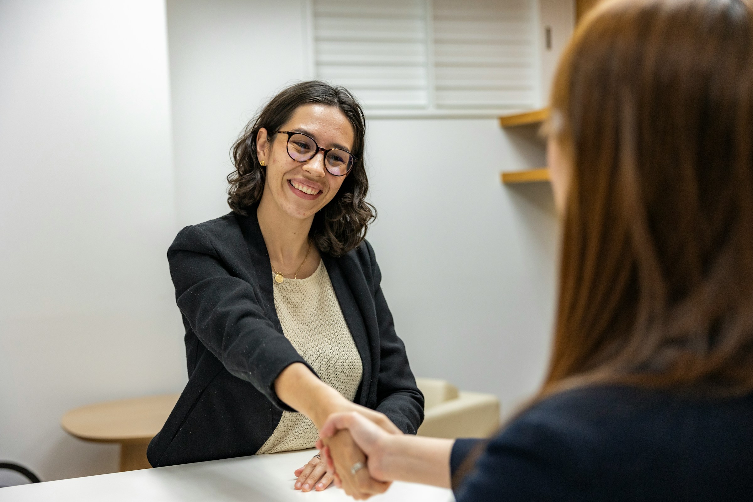 woman smiling - How To Hire International Employees