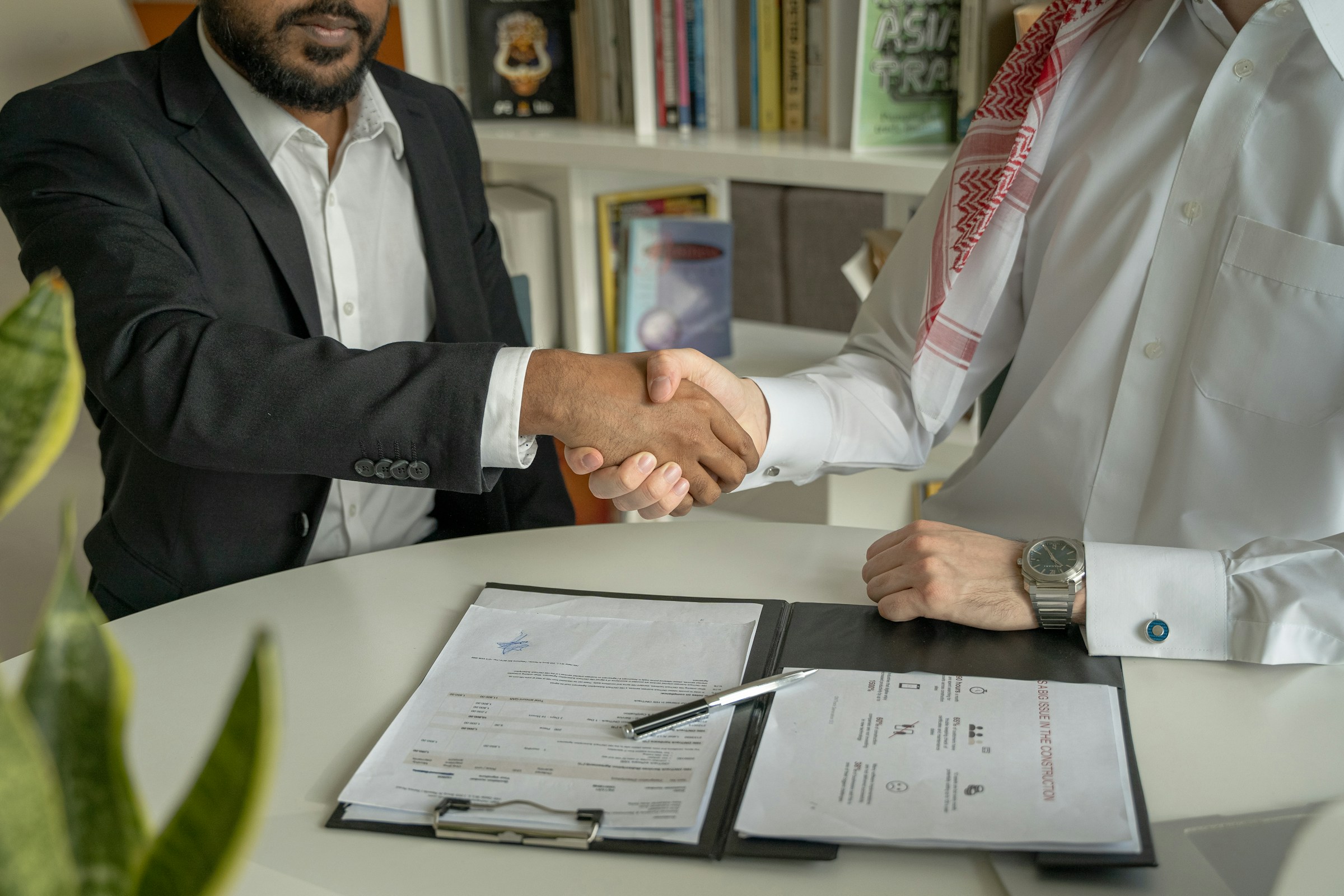 men shaking hands - Saudi Labour Law