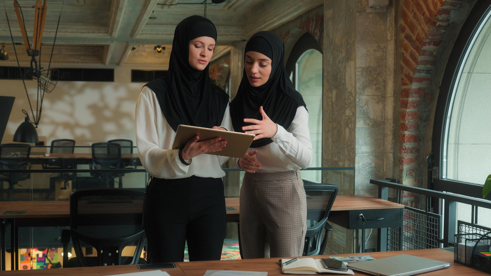 women on a tablet - New Rules in Saudi Arabia for Final Exit