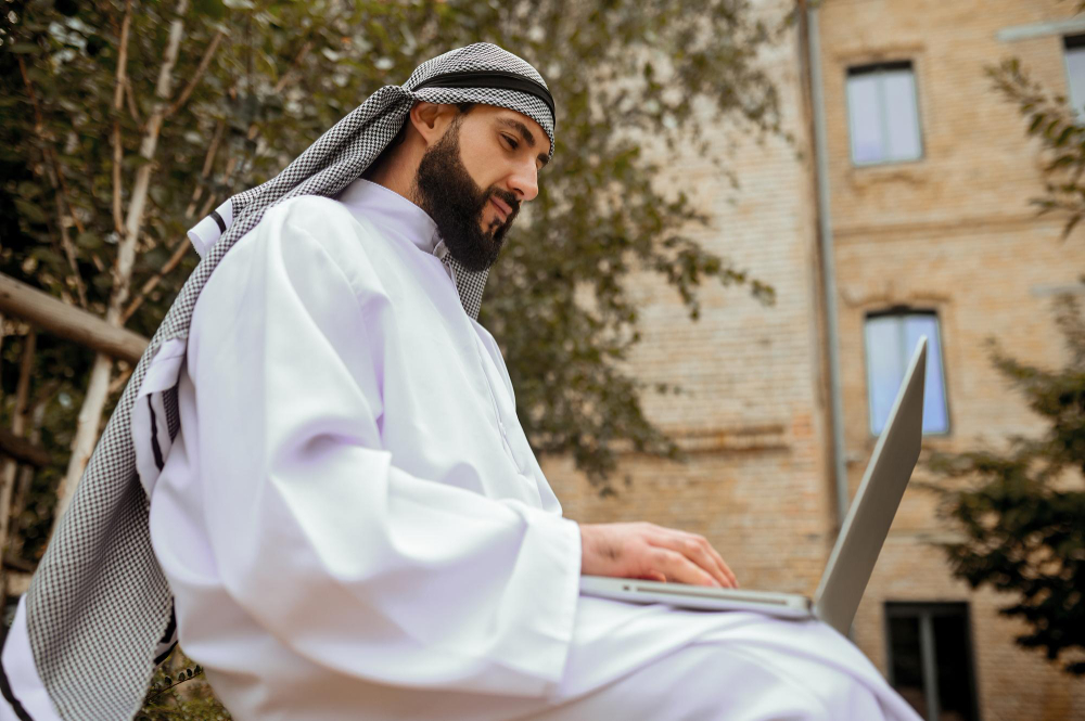 man using a laptop - Saudi Labor Law End of Service