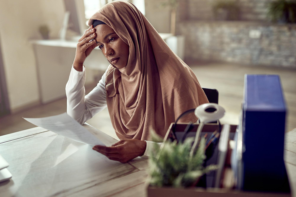 woman looking stressed - Wage Protection System