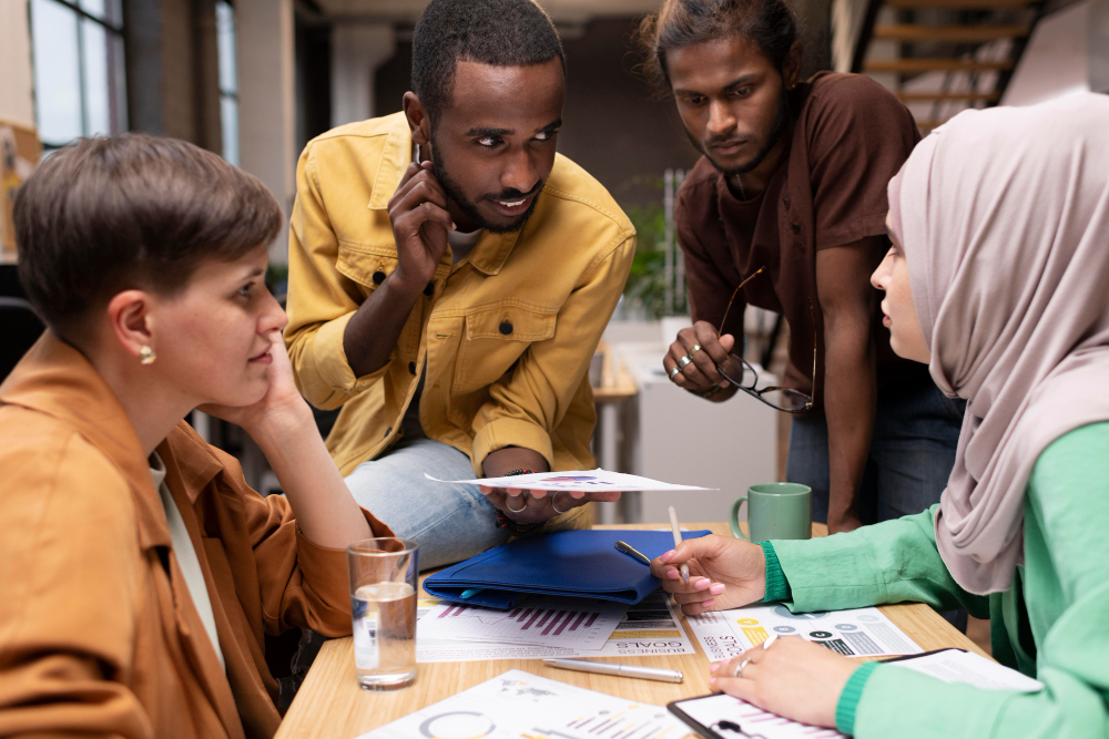 employees in a meeting - Mudad KSA