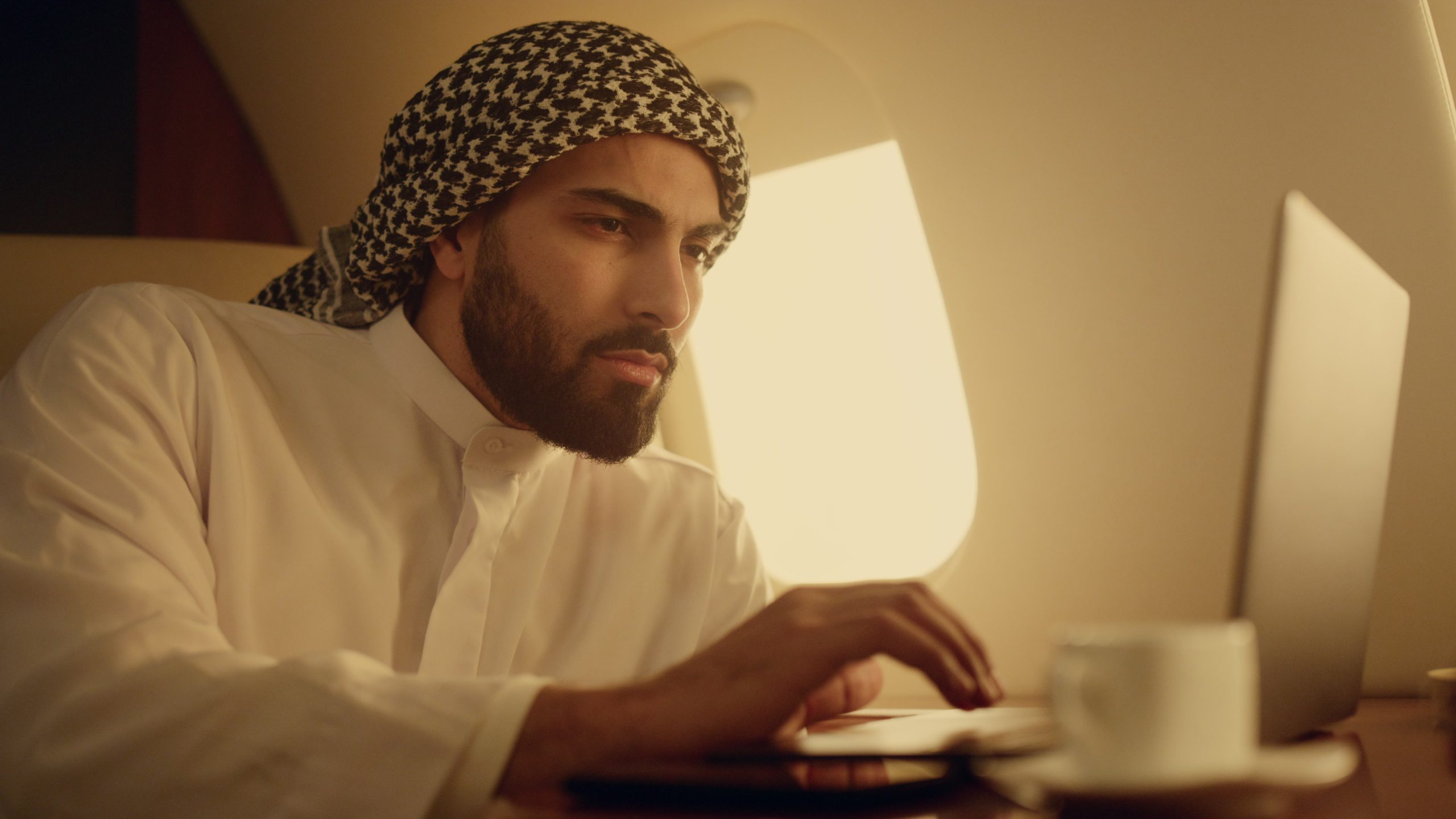 man on a laptop - Velocity Global Alternatives