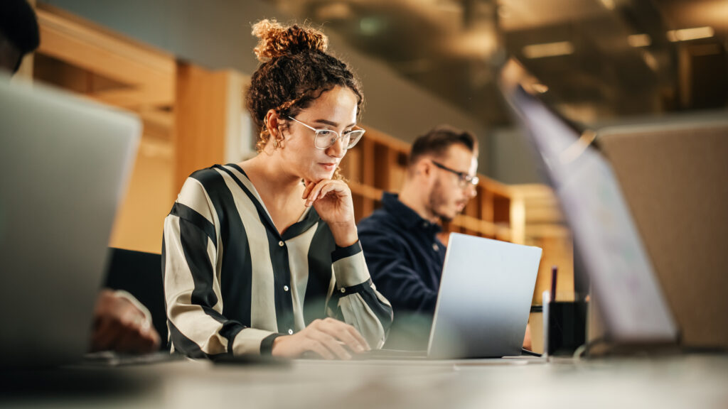 employees working their laptops - AI Tools for HR