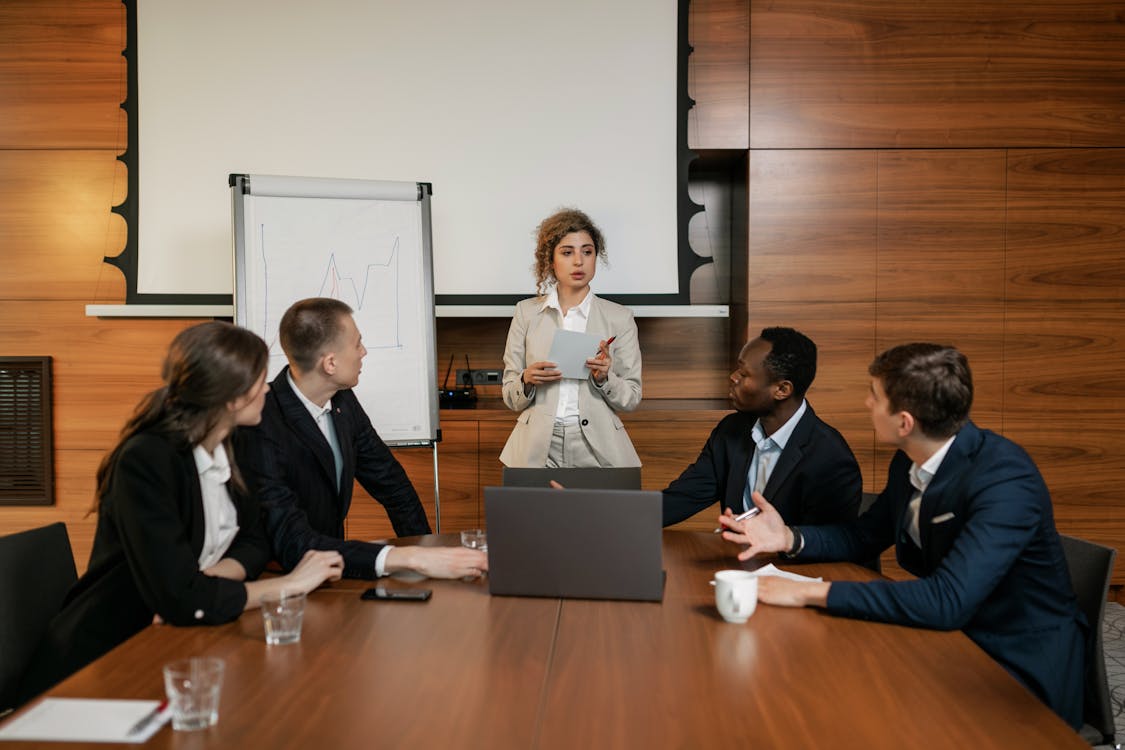 team in a meeting - Remote Team Management