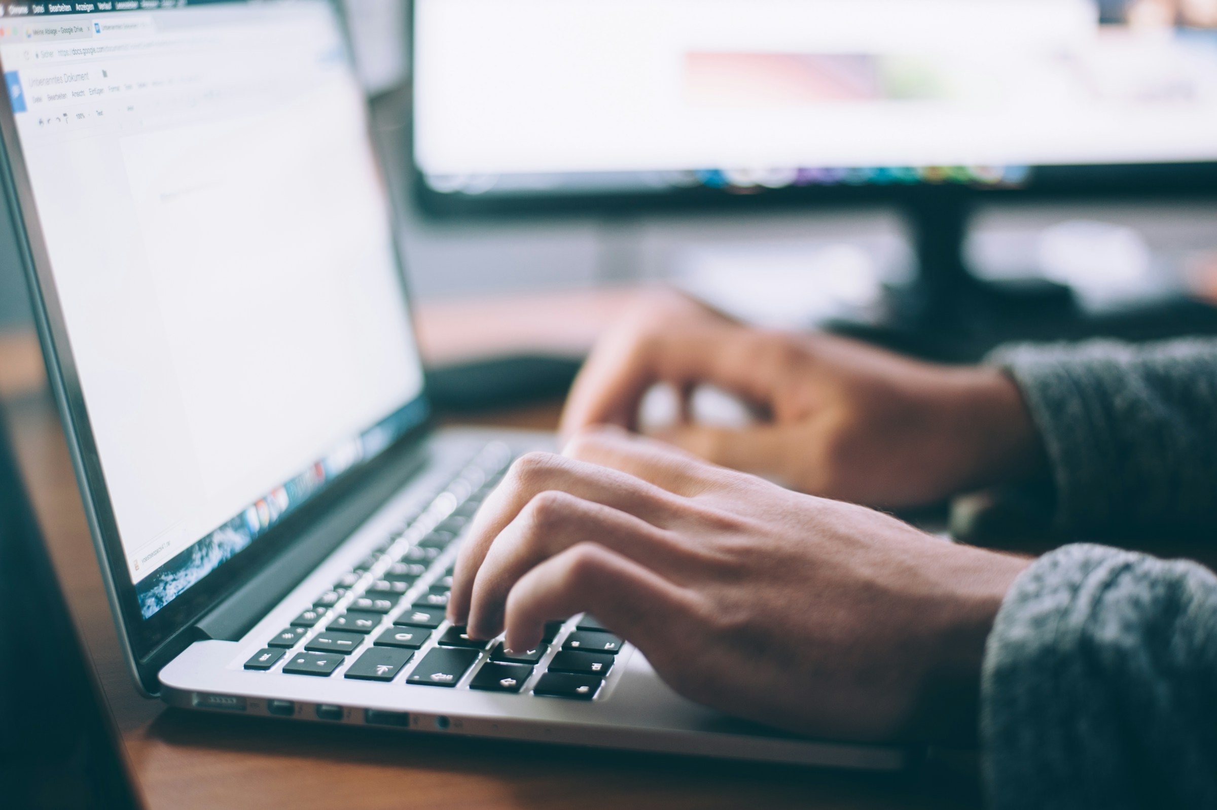 Person Using Laptop - Setting Up a Company in Saudi Arabia