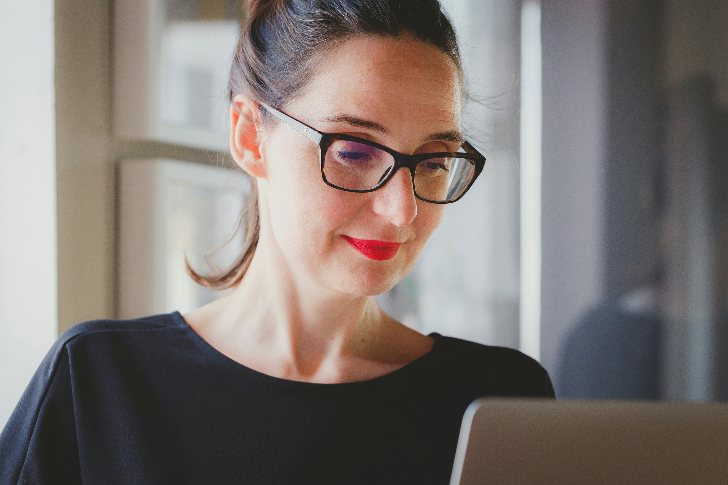 Woman Using Laptop - UAE VAT Registration Threshold