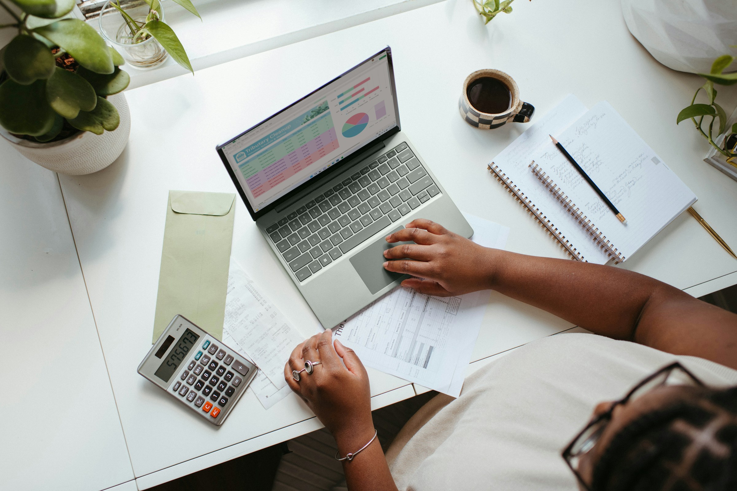 Person Working on Laptop - UAE Business License Cost