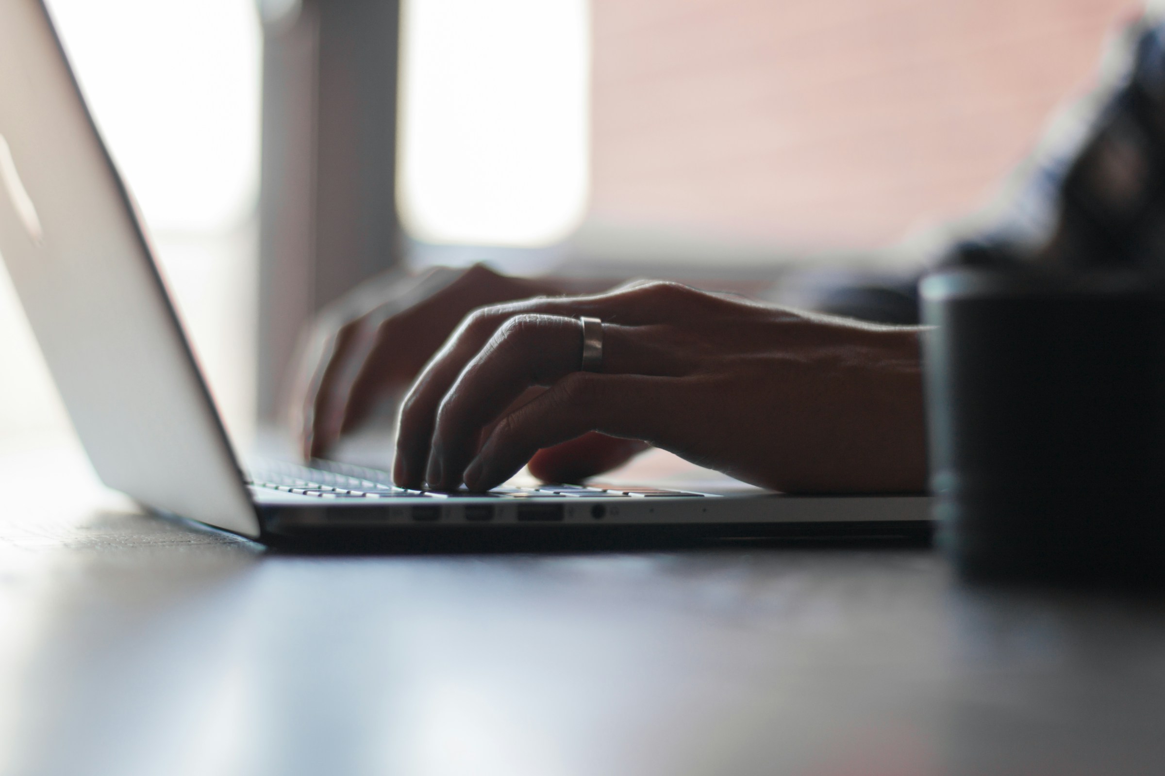 Person Working on Laptop - UAE Companies Law