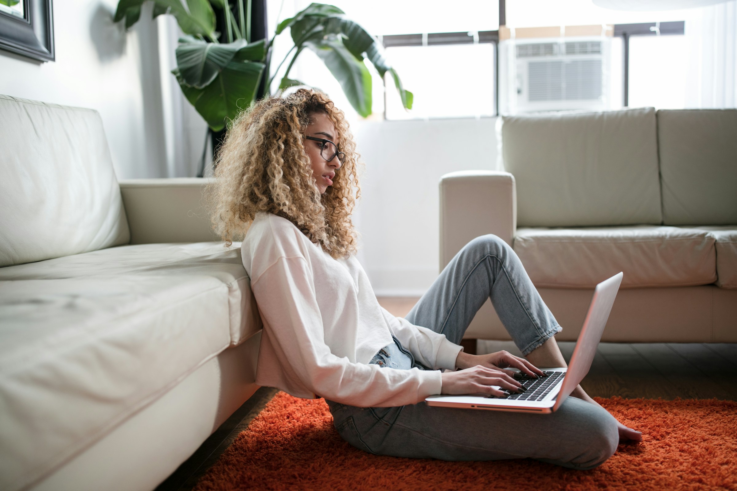 Person Working on Laptop - UAE Business License Cost